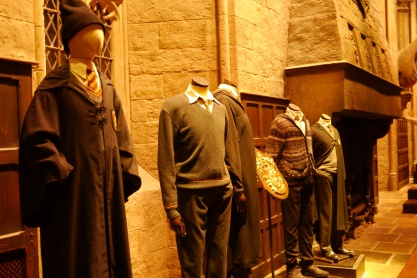 The Gryffindor uniform on the far left was Harry Potter's in the first movie.